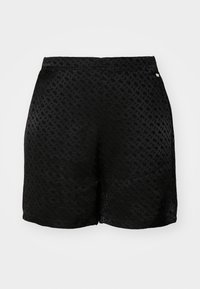 Shorts noirs avec un motif texturé et un design tissé. Ces shorts présentent une finition en tissu lisse et un accent logo subtil sur la taille.