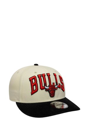 Cream baseball cap with a black textured brim, featuring red embroidered "BULLS" text and a logo of a bull on the front.