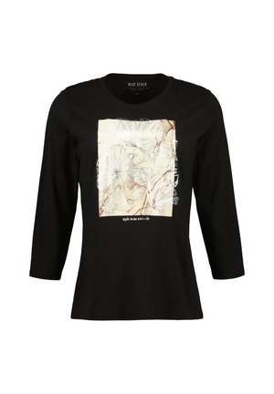 Schwarz langärmliges T-Shirt mit einem quadratischen cremefarbenen Grafikdesign, das florale Linienkunst und den Text "Stil ist eine Einstellung" am unteren Rand zeigt.