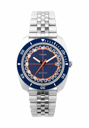 Timex quartz watch with a stainless steel bracelet, navy blue dial, orange accents, and a rotating bezel marked with intervals.