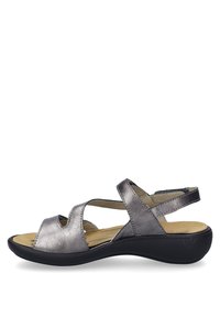 Metallic silver sandals with open toe, cutout design, dual straps, and a cushioned insole. Black rubber outsole for grip and stability.