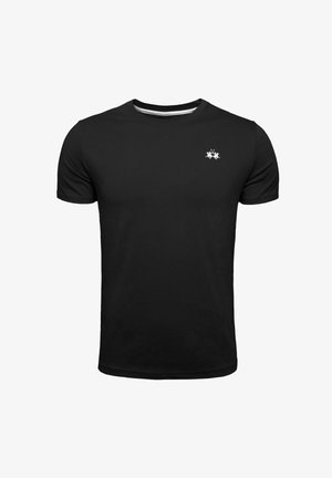 T-shirt en coton noir à manches courtes, encolure ronde et petit logo blanc sur la poitrine gauche. Texture douce et coupe standard.