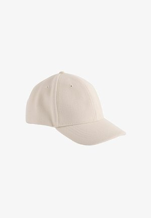 Beige fleece sapka ívelt karimával, hat paneles dizájnnal és varrott részletekkel. Szellőzőnyílásokkal és textúrázott felülettel rendelkezik.