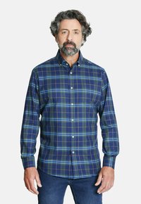 Camisa de cuadros de manga larga en azul marino, verde y marrón. Cuenta con cuello abotonado y botones blancos, hecha de tela de algodón suave.