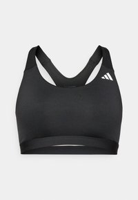 Sujetaligas deportivo negro con textura suave, con escote redondo y diseño de espalda cruzada. Acento de logo blanco en la parte superior derecha.