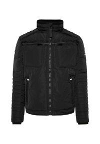 Schwarze gesteppte Jacke mit hohem Kragen, Reißverschluss, zwei Brusttaschen und gerippten Bündchen; verfügt über strukturierte Ärmeldetails.