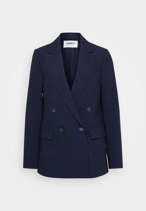 Blazer bleu marine à double boutonnage avec des revers en pointe, deux poches avant et des boutons noirs à l'avant. Fabriqué en tissu texturé.