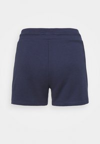 Shorts bleu marine avec une taille élastique et un design simple, vus de dos sur un fond clair uni.