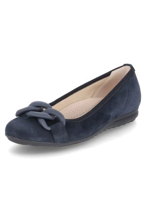 Navy blue suede flat shoe featuring a soft, textured exterior, a rounded toe, and a decorative chain accent on the front.