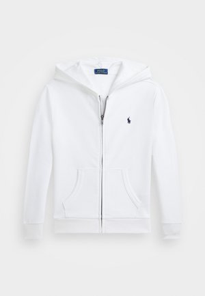 Bijela zip-up trenirka napravljena od meke tkanine, s prednjim džepom, rebrastim manžetama, kapuljačom i malim mornarskim logotipom na prsima.