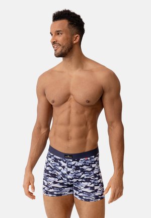 Boxer briefs con motivo di camuffamento blu e vita color navy. Realizzati in tessuto morbido e elasticizzato, presentano una superficie liscia e un design aderente.