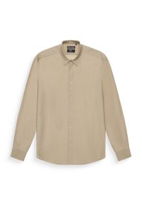 Camisa de manga larga beige fabricada en tela suave. Cuenta con un collar abotonado y botones en la parte delantera. Ajuste entallado con dobladillo recto y puños abotonados.