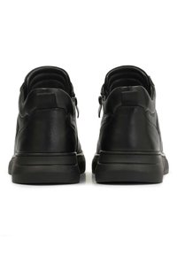 Black leather sneakers with a smooth texture, low profile, padded collar, and zippered closure, featuring a rubber outsole for grip.