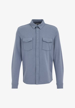 Langegeslagen overhemd van zacht blauw stof, voorzien van een puntkraag, twee borstzakken, knopen aan de voorkant en een afgeronde zoom.