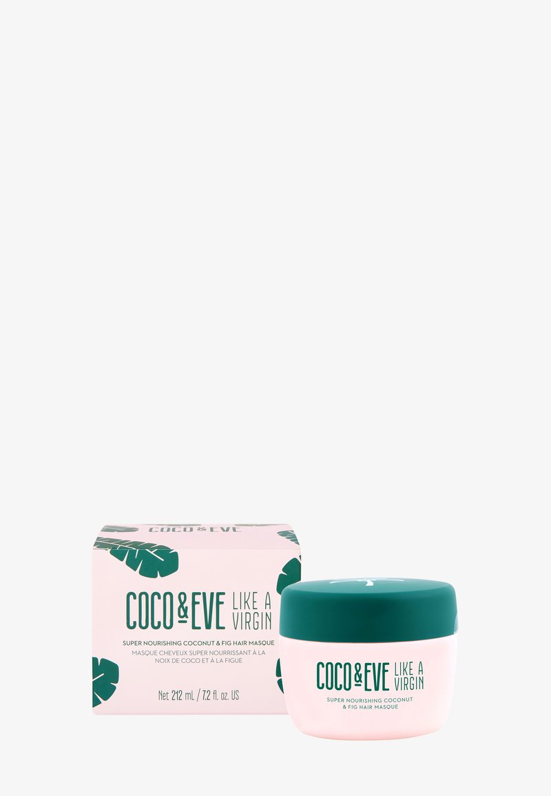 Coco & Eve Like a Virgin-hårmask i en rund, genomskinlig burk med ett teal-färgat lock, intill en rosa låda med gröna bladmönster. 212 mL.