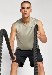 Nike Performance TEE RESET - Top - light army/black