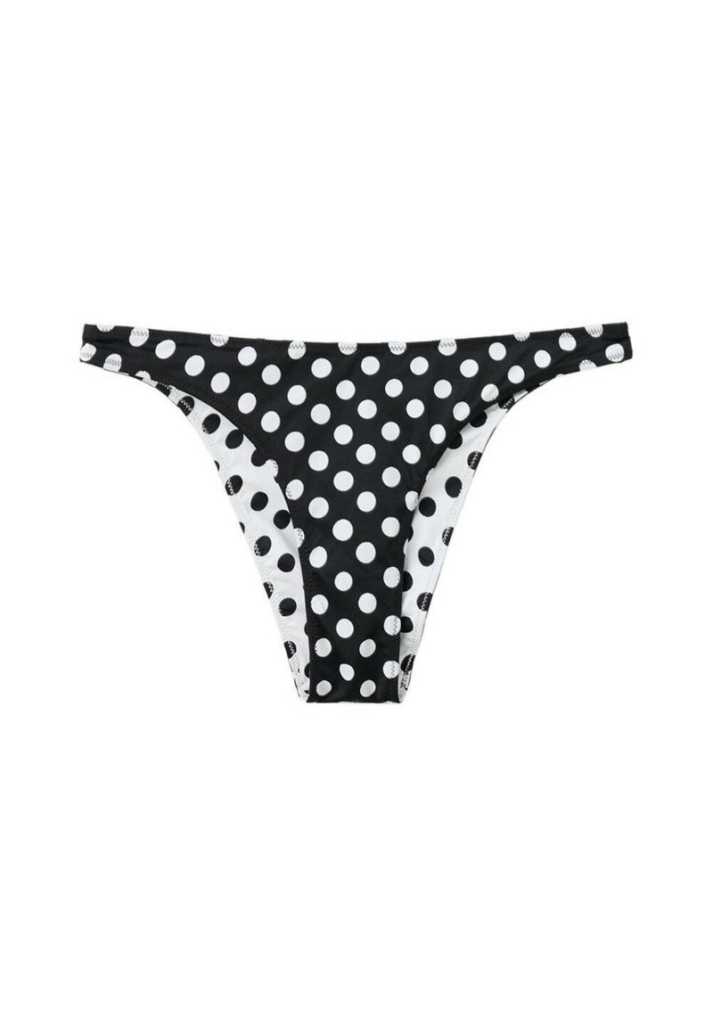 Bas de bikini noir à pois blancs, côtés étroits et taille basse, présenté sur fond blanc.