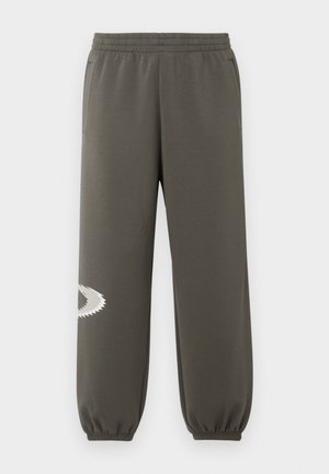 Dark olive green sweatpants with an elastic waistband, side pockets, a tapered fit, and a white jagged logo detail on the left leg.