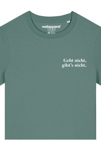 T-Shirt mit kurzen Ärmeln und Rundhalsausschnitt in gedämpftem Teal. Auf der Vorderseite ist weißer Text: "Geht nicht, gibt's nicht." Weicher, glatter Stoff.
