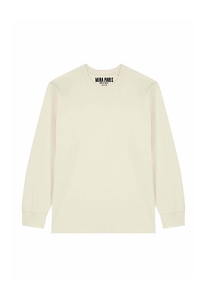 Beige shirt met lange mouwen en ronde hals, met geribbelde manchetten en een "MIRA PARIS" label gedrukt aan de binnenkant van de halslijn.