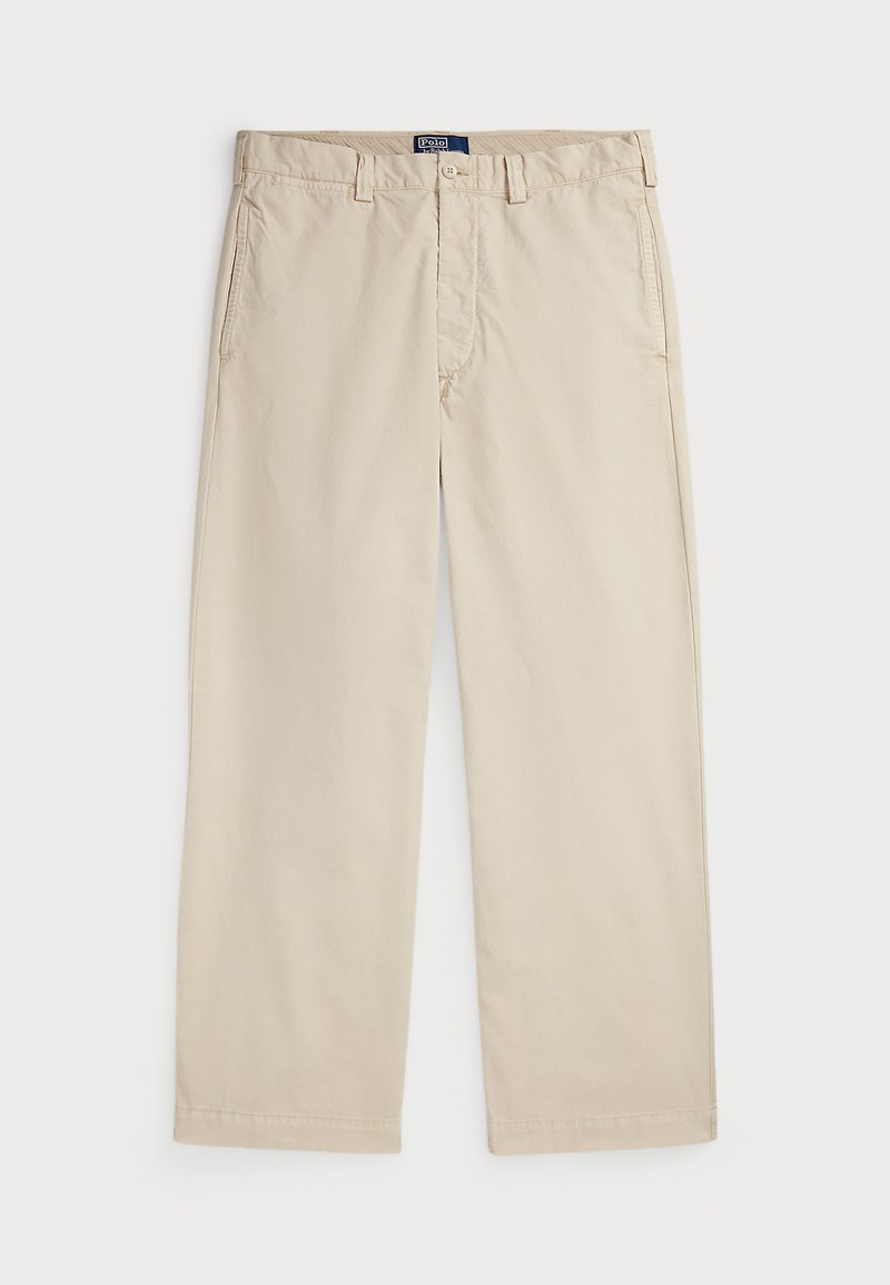 Beżowe chinosy z bawełny o prostym kroju, z zapięciem na guzik i dwoma przednimi kieszeniami. Gładka faktura i jednolity kolor.