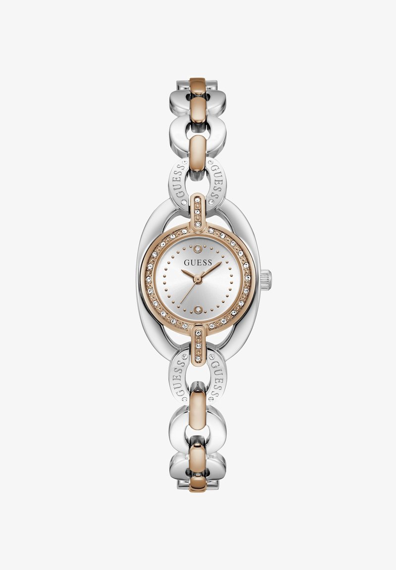 Ασημένιο και ροζ χρυσό ρολόι Guess με στρογγυλό καντράν διακοσμημένο με κρύσταλλα και μπρασελέ με χαραγμένα λογότυπα Guess.