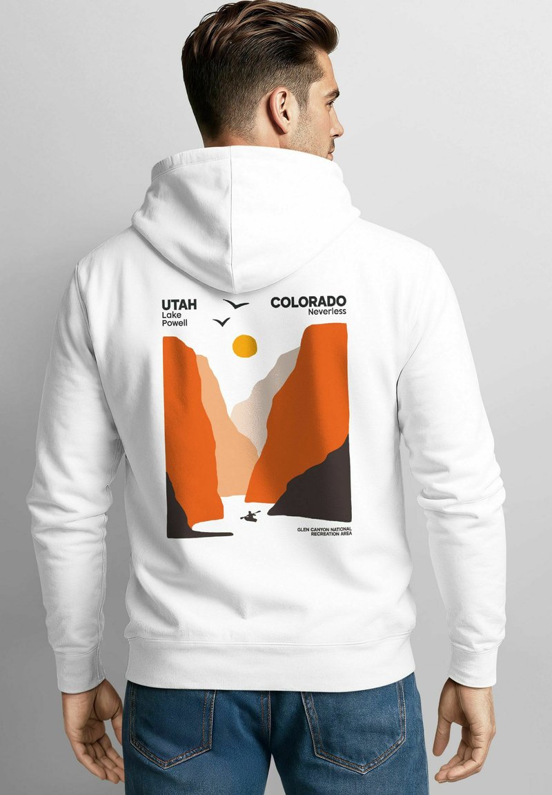 White hoodie featuring a graphic print of orange and beige canyons, a sun, and birds. Text includes "Utah Lake Powell" and "Colorado Nevertheless."