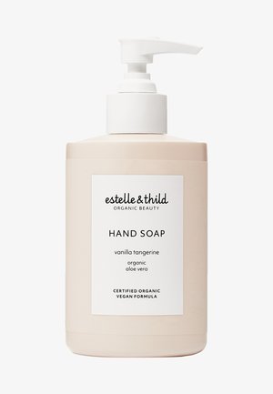 Pompfles handzeep in een zachte beige tint. Etiket met zwarte tekst die de geur (vanille mandarijn) en ingrediënten (biologische aloë vera) vermeldt.