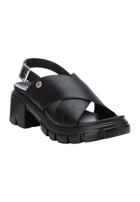 Sandali slingback neri in pelle con strap incrociati, suola platform chunky e dettaglio in metallo sulla cinghia alla caviglia.