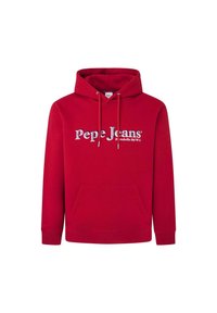 Sudadera roja hecha de tejido suave, con un bolsillo frontal, cordones ajustables y un logo audaz y reflectante en el pecho. Diseño de corte clásico.