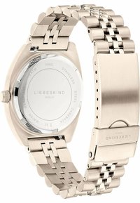 Edelstahl-Uhr mit einem silberfarbenen Gliederarmband, rundem Gehäuse, glatter Rückseite, eingraviertem Markennamen und wasserfesten Eigenschaften.
