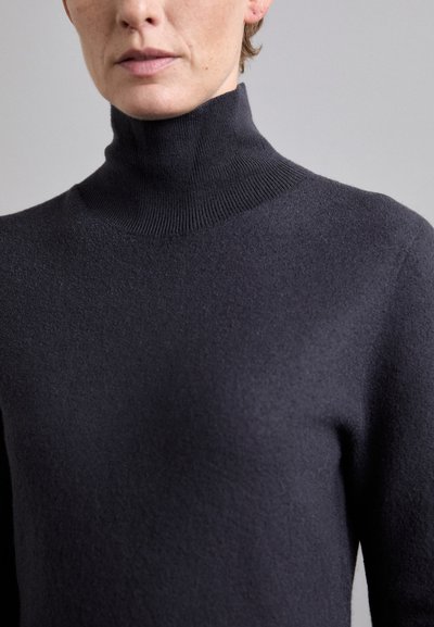 Dunkelgrauer Rollkragenpullover aus einem weichen, strukturierten Stoff. Verfügt über ein eng anliegendes Design mit einem hohen Kragen und nahtlosem Halsabschluss.
