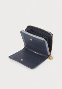 Navy leather wallet with a zip closure, multiple card slots, and a gold-tone accent. Features a contrasting light blue edge detail.