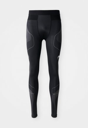 Schwarze Sportleggings aus dehnbarem Material, mit breitem Bund, Netzpaneelen und reflektierenden Akzenten an den Seiten.