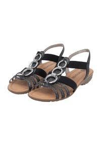 Schwarze Riemchensandalen aus texturiertem Material mit metallischen Kettenakzenten und einem gepolsterten, beigen Fußbett; leichte Sohle für zusätzlichen Komfort.