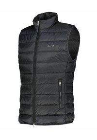 Zwarte, gevoerde mouwloze vest met een hoge kraag, ritssluiting aan de voorkant en twee met rits afgesloten zijzakken. Voorzien van subtiele logodetails.