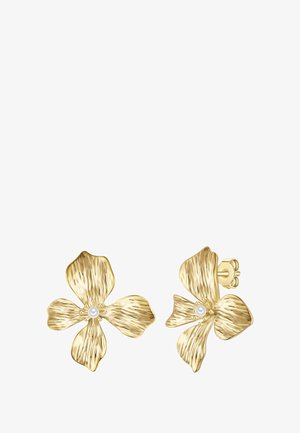 Pendientes en forma de flor de oro con pétalos texturizados y una perla central. El diseño cuenta con un cierre de botón para un uso seguro.