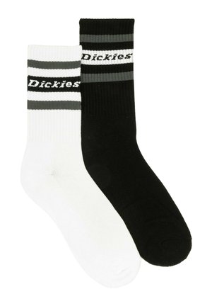 Two pairs of crew socks; one black with white and gray stripes, the other white with gray stripes, featuring the "Dickies" logo.