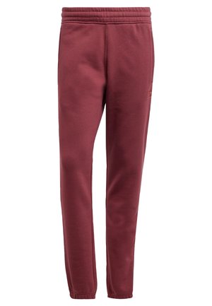 Bordeauxkleurige sweatpants van zacht katoen, met een elastische tailleband, tapered pijpen en een klein logo-detail nabij de heup.