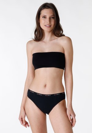 Top bandeau nero abbinato a perizoma nero con una fascia in vita con il logo Lovable. Texture liscia e design aderente.