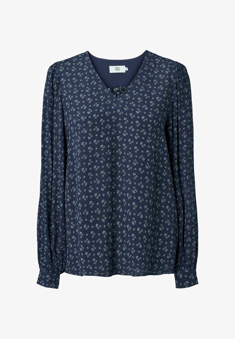 Blouse bleu marine à manches longues avec petit motif floral, col en V et poignets boutonnés.
