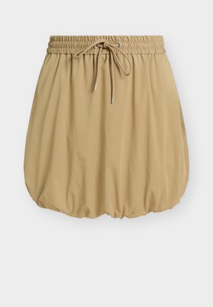 Μπεζ φουστάνι με φούσκες, ελαστική μέση και κορδόνι δέσιμο, με πιέτες στο τελείωμα που δημιουργούν ένα όγκο σιλουέτας.