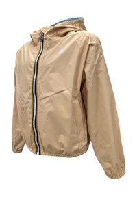 Giubbotto windbreaker beige chiaro con cappuccio, zip frontale, polsini elastici e tasche laterali. Presenta una cerniera e dettagli del logo a contrasto.
