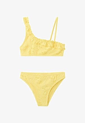 Yellow lace bikini set with asymmetrical top featuring one thick ruffled strap and one thin strap, paired with matching high-cut bottoms.
