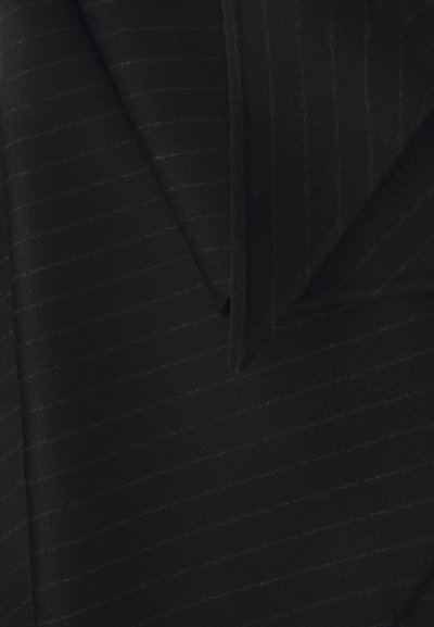 Black wool blazer featuring a textured fabric with subtle pinstripes, notch lapels, and tailored design elements.