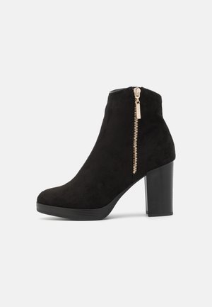 Bottines à talons hauts - black