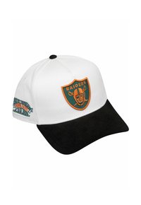 White cap with a black visor, featuring an orange Raiders logo patch and green embroidery on the side. Made of woven fabric.