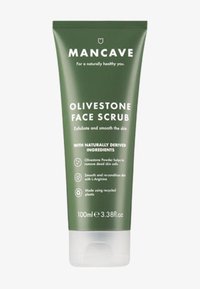 Groene kunststof tube met witte tekst; het label zegt "Olivestone Face Scrub" met details over exfoliërende eigenschappen en ingrediënten. Inhoud 100 ml.