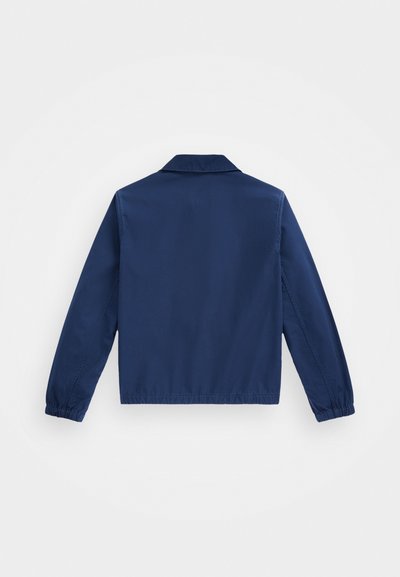 Marineblaues Jackett mit einem Kragen, elastischen Bündchen und lässigem Schnitt. Glattes Material mit minimalen Designdetails und ohne sichtbare Hardware.