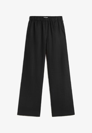 Pantaloni neri a gamba larga con vita elastica e tasche laterali, distesi su sfondo bianco.